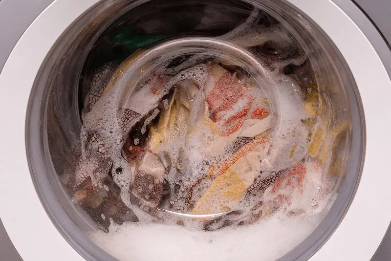 Clothes washing in a soapy washing machine.
